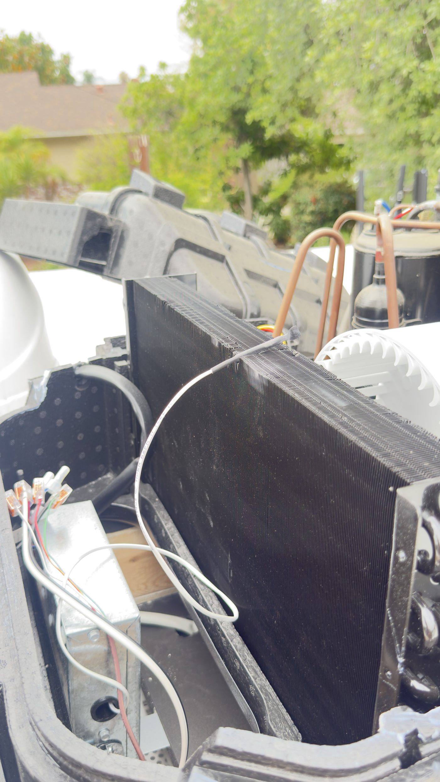 RV rooftop air conditioning unit being serviced