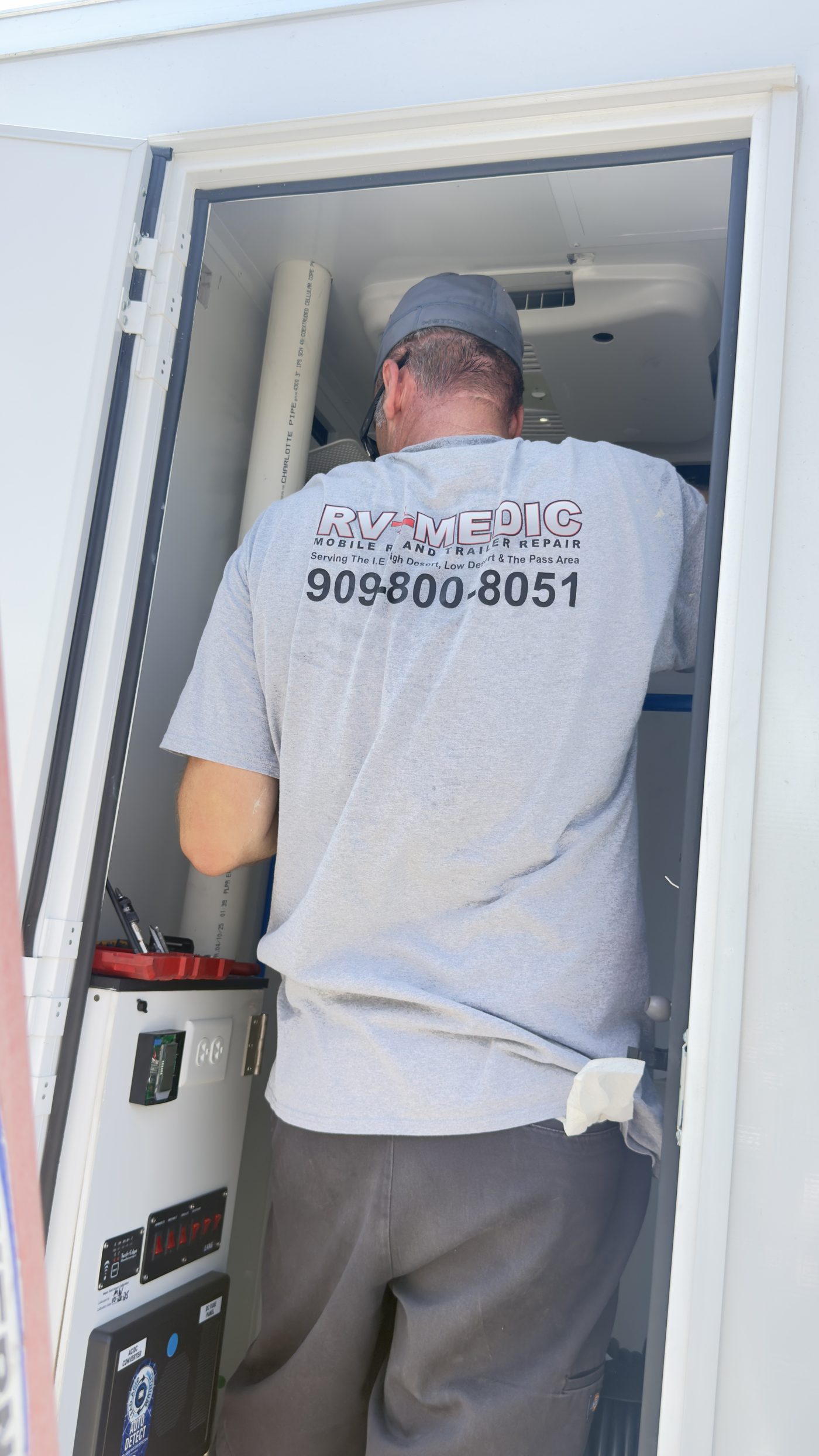 RV Medic technician working on a motorhome